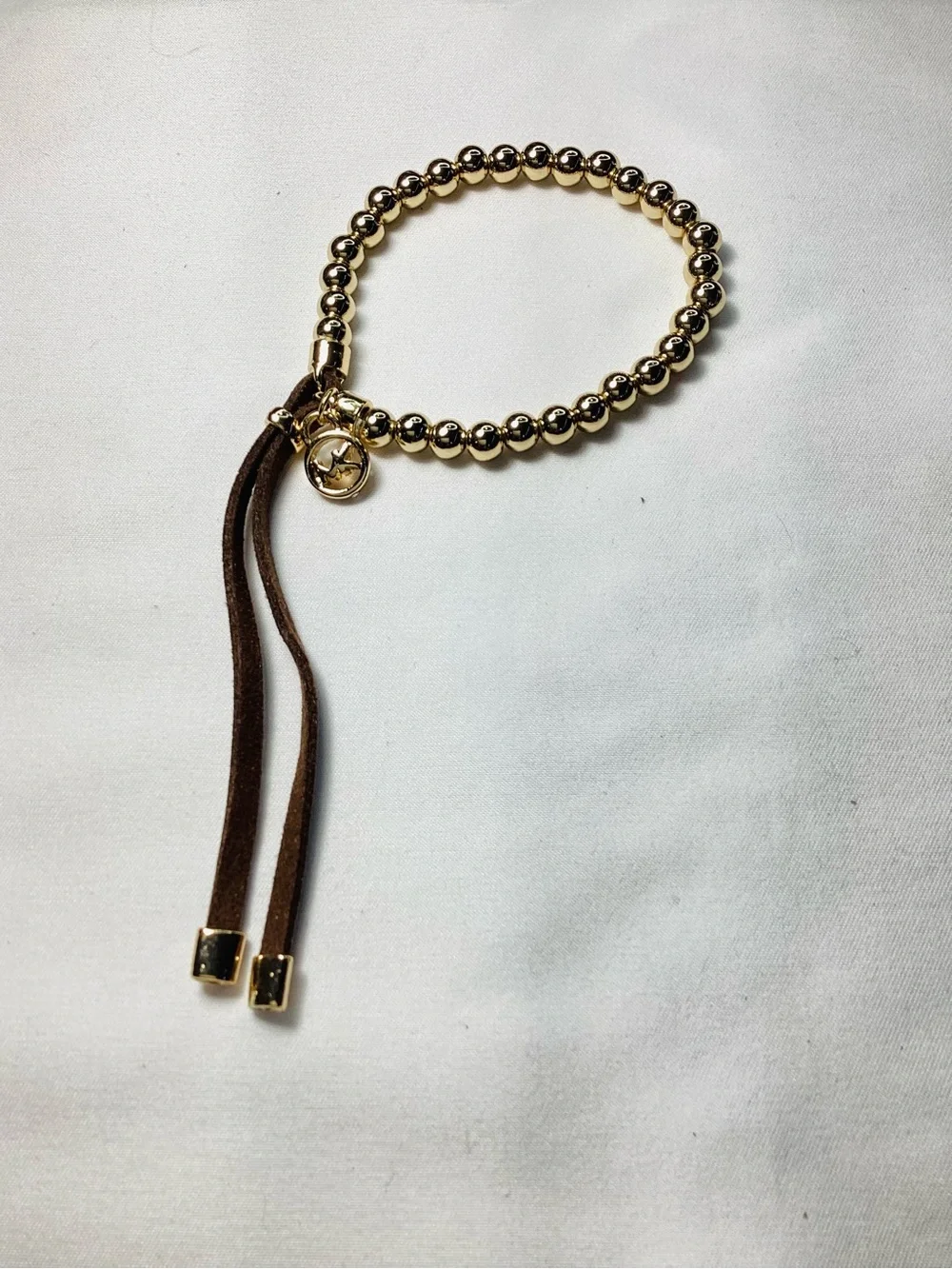 Michael Kors NWT and Dust Bag Gold-Tone Beaded Brown Suede Logo Charm Bracelet